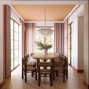 a dining room with a table and chairs at Sea You Beach House in Rogowo