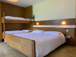Postel nebo postele na pokoji v ubytování Locanda La Ruscoletta