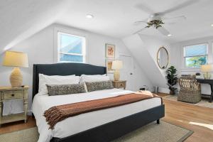 a bedroom with a bed and a ceiling fan at Charming 3BR Home in Nantucket's Natural Beauty home in Nantucket