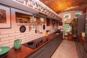 a kitchen with a sink and a counter top at Unique House in Park District in Glasgow