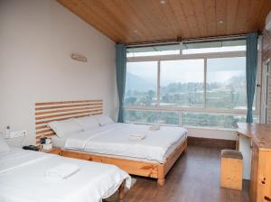 Postel nebo postele na pokoji v ubytování Hills and Horizon Resort + 37 fotografií