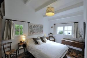 Postel nebo postele na pokoji v ubytování La Maison de Flo