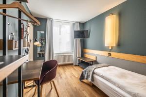 Postel nebo postele na pokoji v ubytování Hotel Jakob