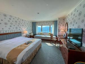 Gulta vai gultas numurā naktsmītnē Evergreen Laurel Hotel - Keelung