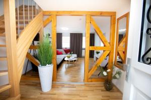 a living room with a sliding glass door at FeWo 02 Maisonette im Carre`Charlott in Pulsnitz