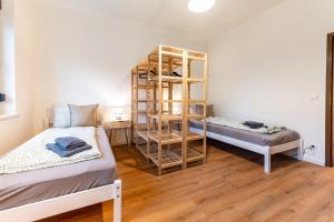 a room with two beds and a bunk bed at Monteurwohnung Dresden-Klotzsche I in Dresden