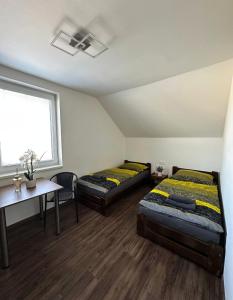 Postel nebo postele na pokoji v ubytování Motel Roudnice