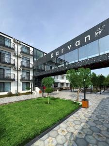 an external view of a building with a walkway at Karvan Sanatorium Naftalan in Naftalan