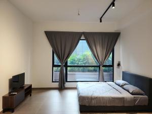 a bedroom with a bed and a large window at MOSSAZ Minimalist Studio 2 in Petaling Jaya +18 photos