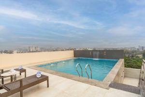 a swimming pool on the roof of a building at Clarks Inn Suites Agra Near Tajmahal in Agra