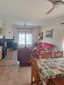 a living room with a couch and a table at Casa maravillosas vistas in Motril
