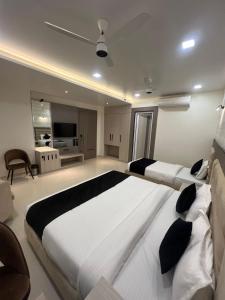 Voodi või voodid majutusasutuse Hotel Glorious Grand toas