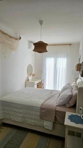 a bedroom with a large bed and a window at Monte View Apartments in Ulcinj +66 photos