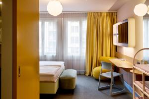 Postel nebo postele na pokoji v ubytování Hotel Continental Park
