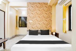 Postel nebo postele na pokoji v ubytování Hotel O Tagore Park + 23 fotografií