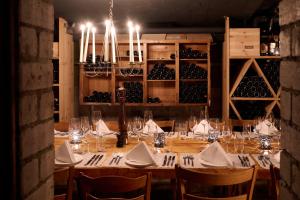 a dining room with a table with glasses and wine bottles at Hotel Continental Park in Lucerne +16 photos