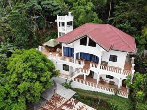an overhead view of a white house with a red roof at RELAX White house, Puerto Galera in Puerto Galera