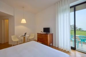 Кровать или кровати в номере Hotel Emilia