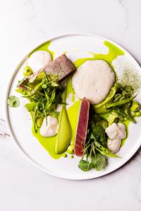 a plate of food with meat and vegetables on it at GRANO HOTEL Solmarina in Wiślinka