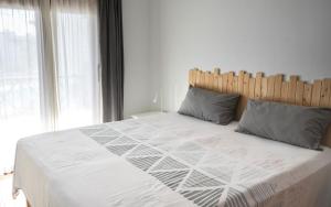 Ein Bett oder Betten in einem Zimmer der Unterkunft CASA VELA by Mhousing