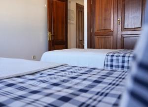 Ein Bett oder Betten in einem Zimmer der Unterkunft CASA VELA by Mhousing
