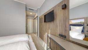 TV a/nebo společenská místnost v ubytování Smart Stay Hotel Station