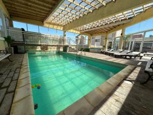a large swimming pool in a building at Suite Premium Vista Panorámica in Santa Teresita