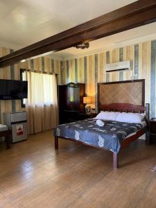 a bedroom with a large bed in a room at L&A Homestay Siargao Beach Resort in General Luna