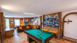 a living room with a pool table in it at Spacious Villa with Private Pool in Monachil in Monachil +23 photos