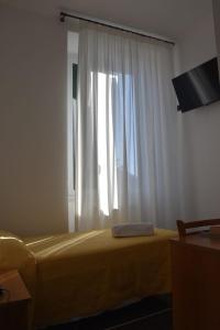 TV a/nebo společenská místnost v ubytování Hotel Le Palme