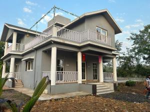 a large house with a balcony on top of it at Huvazeel Villa - Murbad for Monthly rental only in Saralgaon