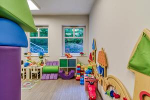 a play room with a bunch of toys in it at Hotel Aqua Sopot - Destigo Hotels in Sopot