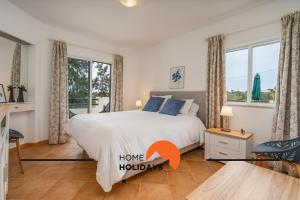 Giường trong phòng chung tại #294 T2 Com Amplo Terraço by Home Holidays