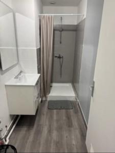 a white bathroom with a shower and a sink at Séjourner chez Roto in Cambronne-lès-Ribécourt