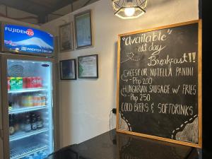 Certifikát, hodnocení, plakát nebo jiný dokument vystavený v ubytování Coconut Inn Moalboal
