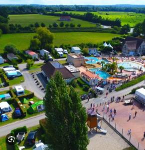 an aerial view of a festival with a parking lot at Bungalow convivial à Saint-Arnoult avec piscine in Saint-Arnoult
