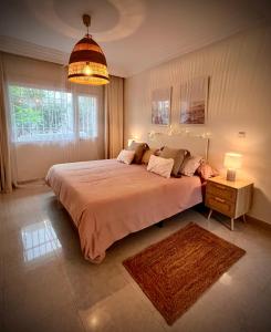 Posteľ alebo postele v izbe v ubytovaní Apartamento en Monte Gibralfaro piscina compartida