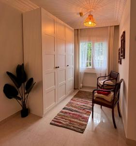 Posedenie v ubytovaní Apartamento en Monte Gibralfaro piscina compartida