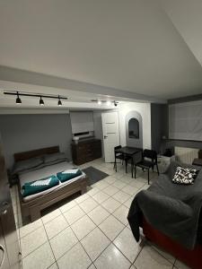 a living room with a bed and a table at Pokoje Maria Międzybrodzie Bialskie in Międzybrodzie Bialskie