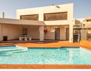 a large swimming pool in front of a house at Chesapeake Bay 42 in Margate