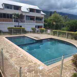 a large swimming pool in front of a building at Tilagonbleu à la Saline les Bains in La Saline Les hauts  +27 photos