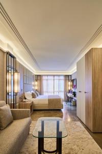 a hotel room with a bed and a table at VP Madroño in Madrid