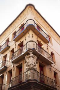 a building with balconies on the side of it at Letoh Letoh Bilbao in Bilbao