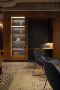 a room with two chairs in front of a closet at Letoh Letoh Bilbao in Bilbao