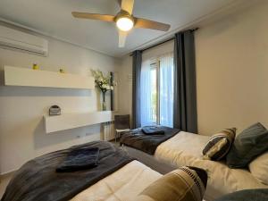 A bed or beds in a room at La Torre Golf Resort
