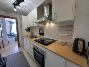 A kitchen or kitchenette at La Torre Golf Resort