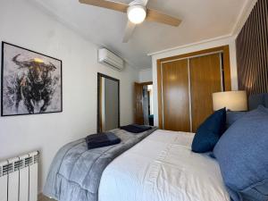 A bed or beds in a room at La Torre Golf Resort