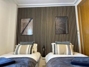 A bed or beds in a room at La Torre Golf Resort