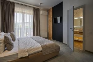 Postel nebo postele na pokoji v ubytování Greitser Elit Chalet