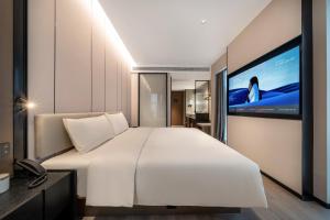 Postel nebo postele na pokoji v ubytování Atour Hotel Dazhou Quxian Wealth Center
